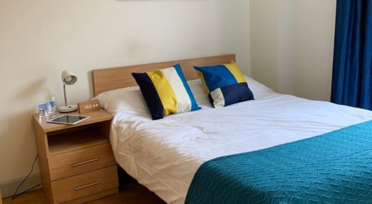 Bed in a typical small studio flat