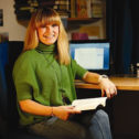Member Ifigeneia Giannadaki by her desk with a book at Goodenough College
