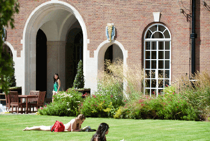 Members read and sunbathe in the Quad in London House at Goodenough College