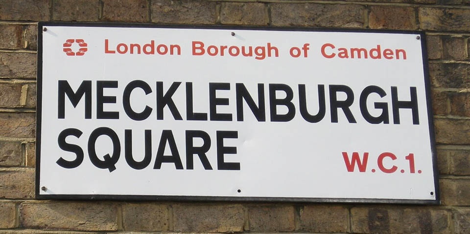 Sign reading Mecklenburgh Square on a brick wall