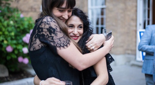 Two Alumni hugging in the quad at Goodenough College