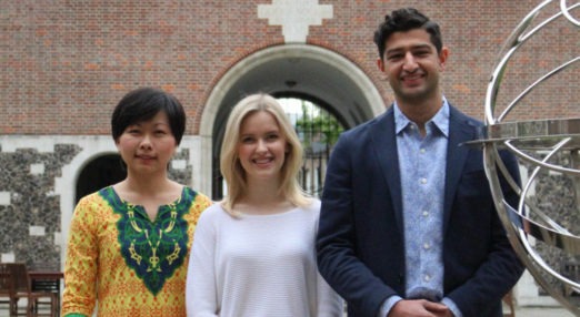 Three Members standing side by side in the quad in London House at Goodenough College