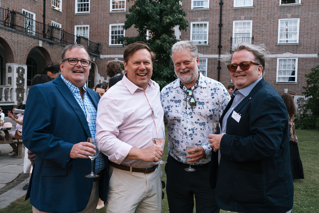 Group of male Alumni at the Goodenough summer party 2026