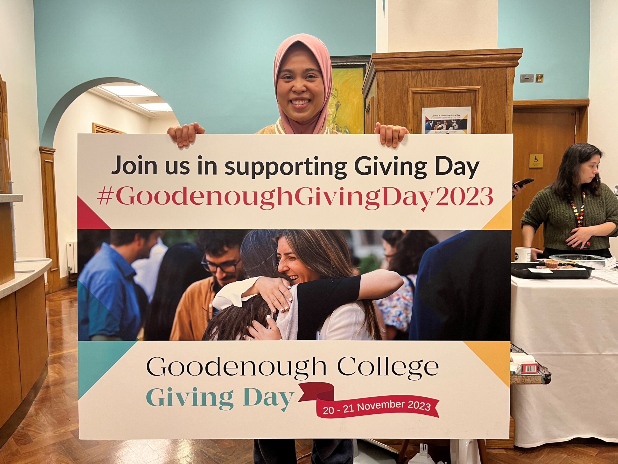 Goodenough Member with the Goodenough Giving Day 2023 poster