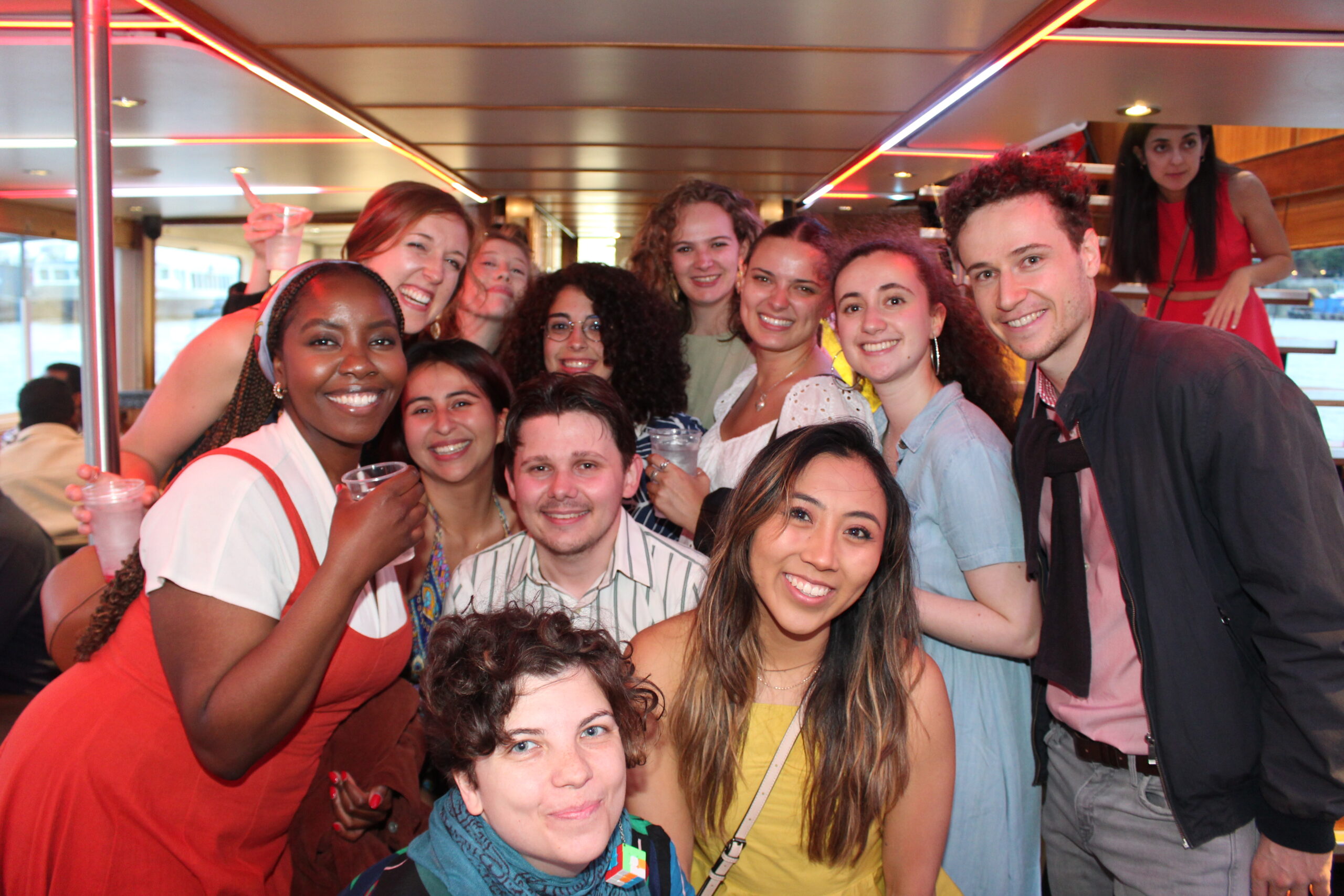 Goodenough College Members posing for a group photo at a Boat Party